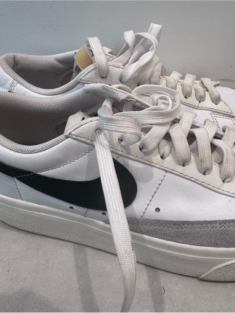 Nike White Sneakers with Black Swoosh and Gray Suede Trim